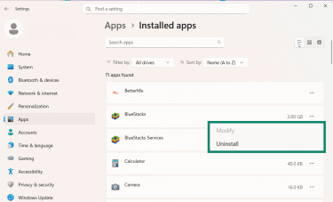 The Windows Installed apps page is open, and the Uninstall option is visible next to BlueStacks.