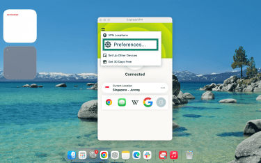 The ExpressVPN macOS app with the menu bar open, and "Preferences" highlighted.