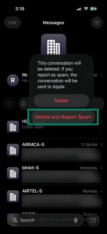 iPhone prompt offering Delete or Delete and Report Spam for a message.